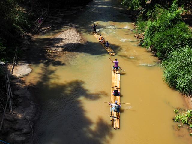 Glide downstream in a bamboo raft