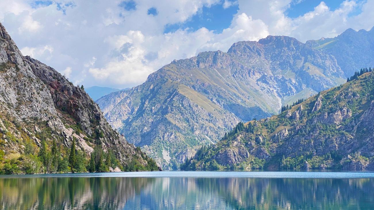Sary Chelek Nature Reserve in Kyrgyzstan, view of the alpine lake with mountains in the background
