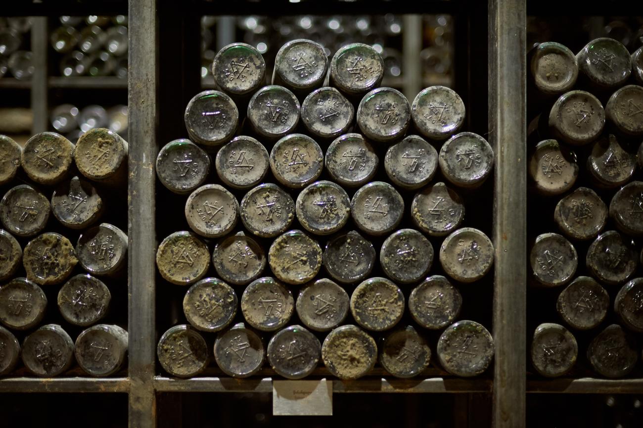 Collection of old wine bottles on a shelf