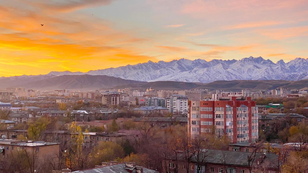 Capital of Kyrgyzstan, Bishkek, view of soviet buildings with the Tien Shan mountains in the background