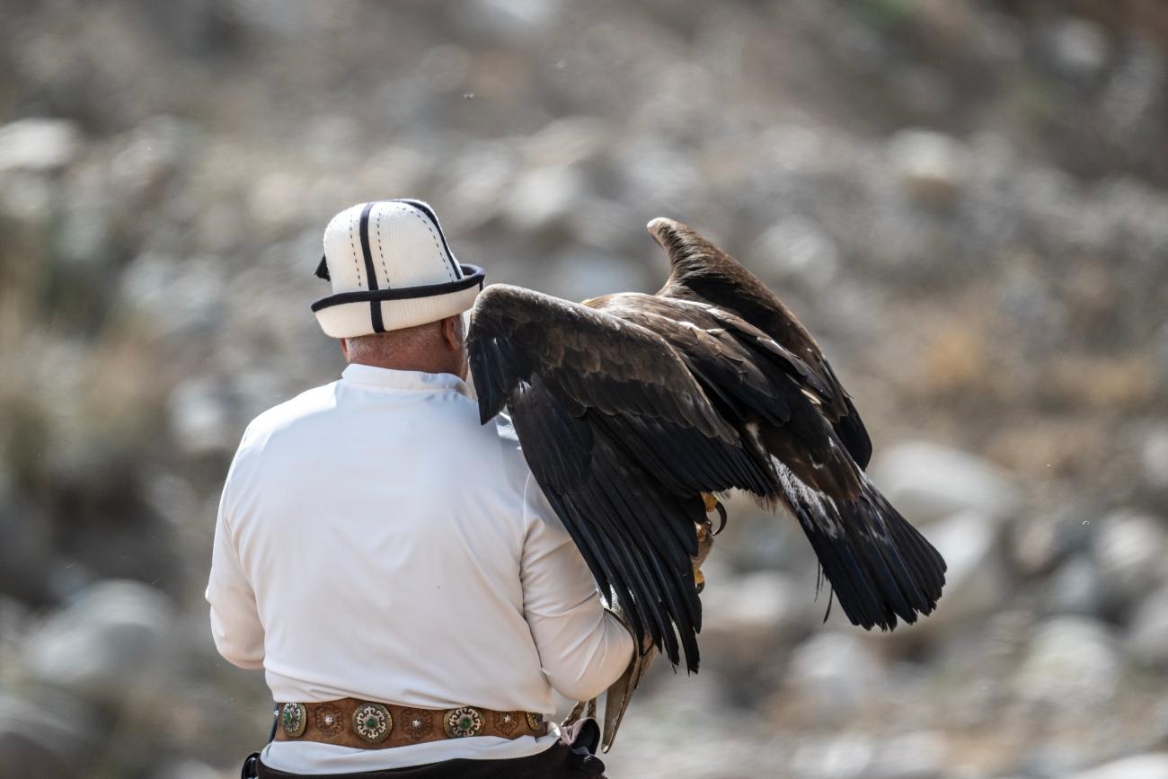 Kyrgyz eagle hunter with his eagle 
